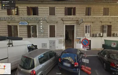 a group of cars parked in front of a building at Alex Romano in Rome