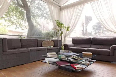 a living room with a couch and a coffee table at Villa Pirandello in Rome