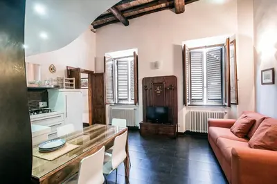a living room with a couch and a table at In Front Of Coliseum in Rome