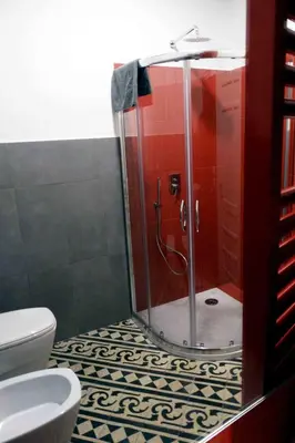 a bathroom with a glass shower with a toilet at Affittacamere ROMA FLAMINIO in Rome