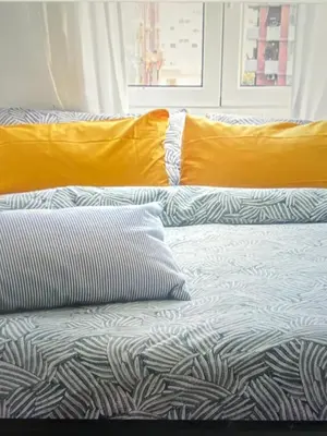 a bed with pillows on it in a room at Panoramic Castle Apt Trastevere in Rome