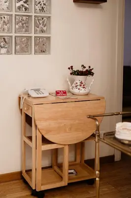 a table with a vase on top of it at La Girandola Bed & Breakfast in Rome