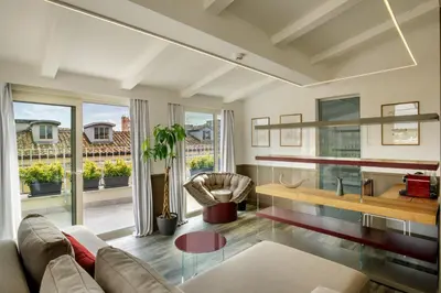 a living room with a couch and a table at Hotel Regno in Rome