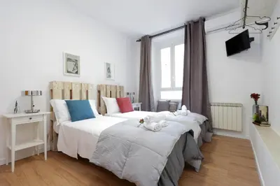 a bedroom with two beds with stuffed animals on them at Monti Central Apartment in Rome