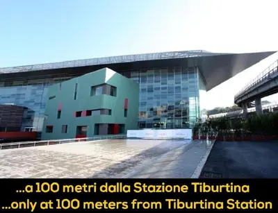 a building in front of a large building at In vacanza da Sara in Rome