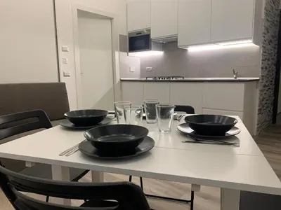 a table with three bowls on it in a kitchen at ARTPA Rome Apartments in Rome