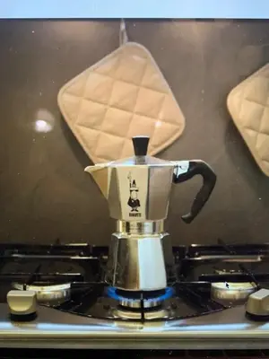 a coffee pot sitting on top of a stove at ARTPA Rome Apartments in Rome