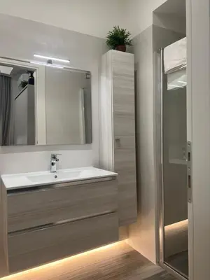 a bathroom with a sink and a mirror at ARTPA Rome Apartments in Rome