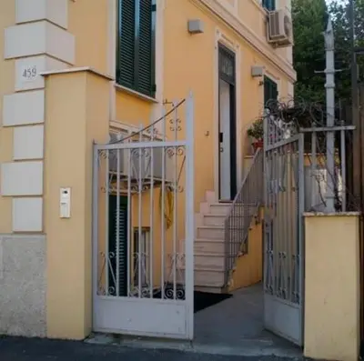 an entrance to a building with a gate and stairs at La Rotella Nel Sacco in Rome
