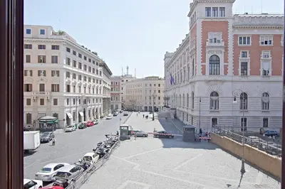 a view of a city street with parked cars and buildings at Cozy Studio Parlamento in Rome