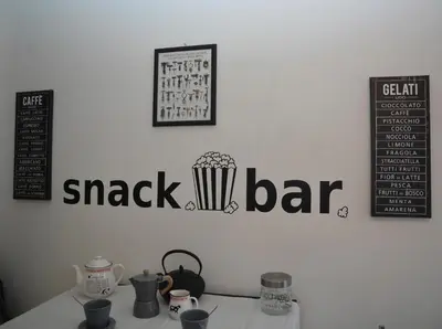 a table with a bar sign on a wall at Vatican Corner Family Apartment in Rome