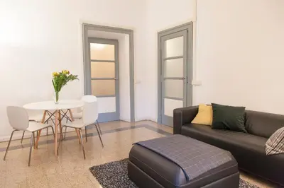 a living room with a couch and a table at Miani House in Rome