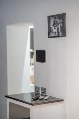 a table in a room with a picture on the wall at iRooms - Spanish Steps in Rome