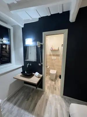 a bathroom with a sink and a toilet at iRooms - Spanish Steps in Rome