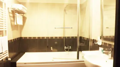 a bathroom with a shower and a sink at Hotel Nautilus in Rome