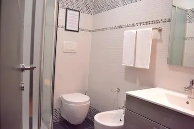 a bathroom with a toilet and a sink at Hotel Nautilus in Rome