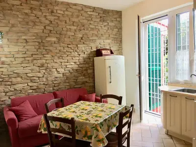 a bathroom with a washing machine and a sink at Appia Park apartament 10 min dal Colosseo in Rome