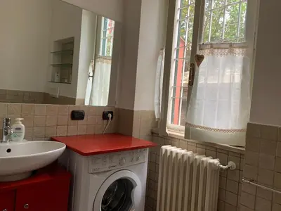 a bedroom with a bed and a dresser and a window at Appia Park apartament 10 min dal Colosseo in Rome