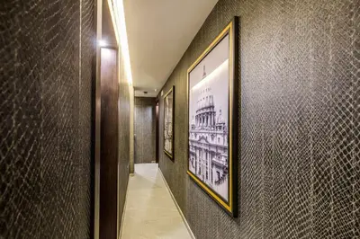 a hallway with two framed pictures on the walls at PAX hotel in Rome