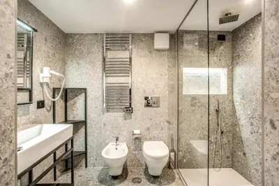 a bathroom with a sink and a toilet and a shower at PAX hotel in Rome