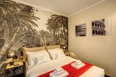 a bedroom with a bed and a wall mural at PAX hotel in Rome