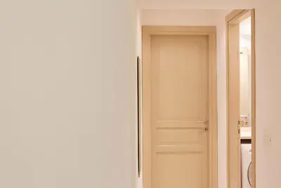 a door in a room with a bathroom at Vatican House in Rome
