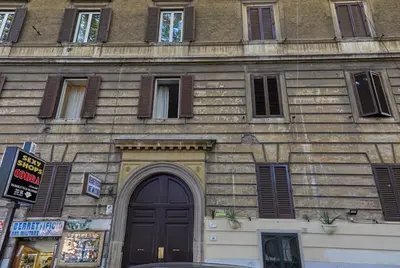 an old building with a door and a window at Vatican House in Rome