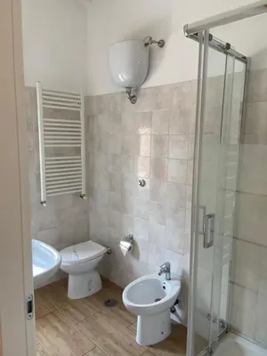 a bathroom with a sink and a toilet and a shower at Juna's guest house in Rome