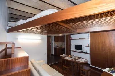 a living room with a couch and a table at Trevi Fountain - Lovely Loft Apartment in Rome