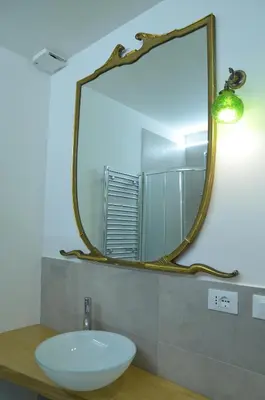 a bathroom with a sink and a mirror at Tempo Lento in Rome