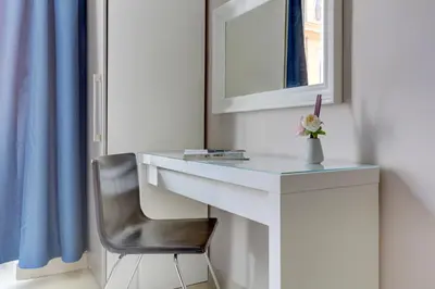 a bedroom with a large bed and a window at Claudia House Roma Termini in Rome