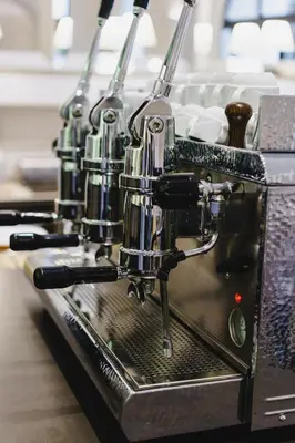 a espresso machine sitting on top of a table at Hotel Smeraldo in Rome