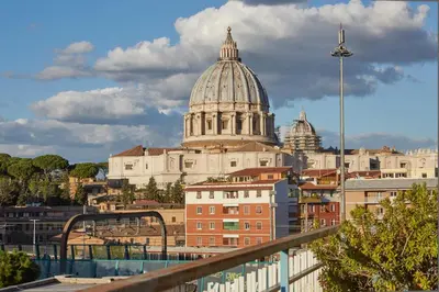 a view of a city skyline with a cathedral at Vatican Luxury Penthouse with Terrace in Rome