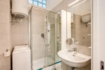 a bathroom with a shower and a sink and a toilet at La casa di Nonna Pina in Rome
