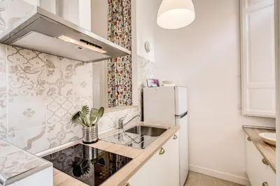 a kitchen with a sink and a refrigerator at La casa di Nonna Pina in Rome