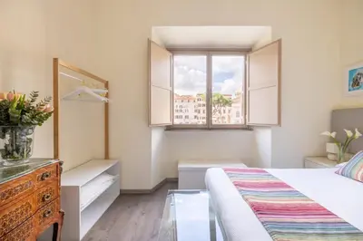 a bedroom with a bed and a window at Superior Relais FCollection Temple View in Rome