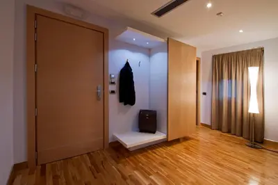 a hallway with a door and a suitcase on the floor at Hotel Gravina San Pietro in Rome
