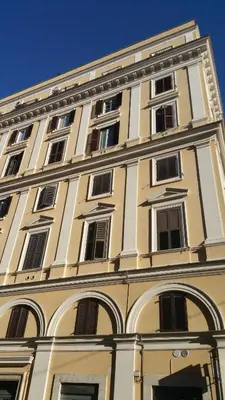 a tall building with many windows on top of it at Principe Guesthouse in Rome