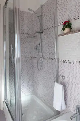 a shower in a bathroom with a tub at La Casetta del Vaticano in Rome