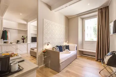 a living room with a couch and a window at The Spanish Suite Via di Ripetta in Rome