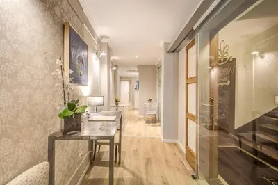 a hallway with a console table and a hallway with a hallway at The Spanish Suite Via di Ripetta in Rome