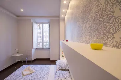a living room with a yellow vase on a counter at Stazione San Pietro 20 Apartment in Rome