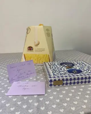 two boxes of donuts and a bag on a table at la casetta dei sogni in Rome