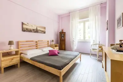 a bedroom with a large bed in a room at la casetta dei sogni in Rome