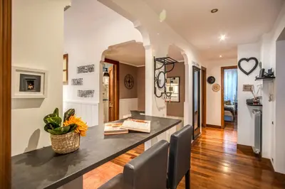 a dining room with a table and chairs at Spanish Steps Miracle Suite in Rome