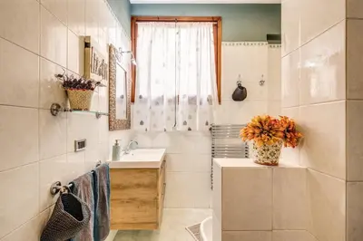 a bathroom with a sink and a mirror at Spanish Steps Miracle Suite in Rome