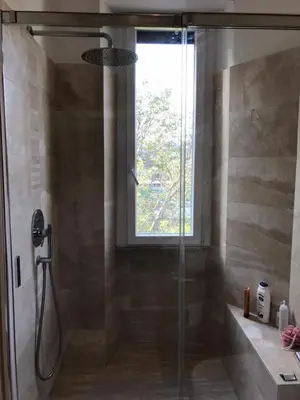 a shower with a glass door in a bathroom at La Riva Sinistra in Rome