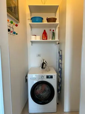 a laundry room with a washer and dryer at La Riva Sinistra in Rome