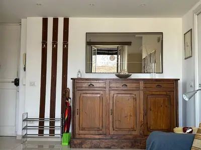 a bathroom with a wooden cabinet and a mirror at La Riva Sinistra in Rome