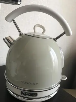a white tea kettle sitting on top of a counter at Domus Palatina in Rome